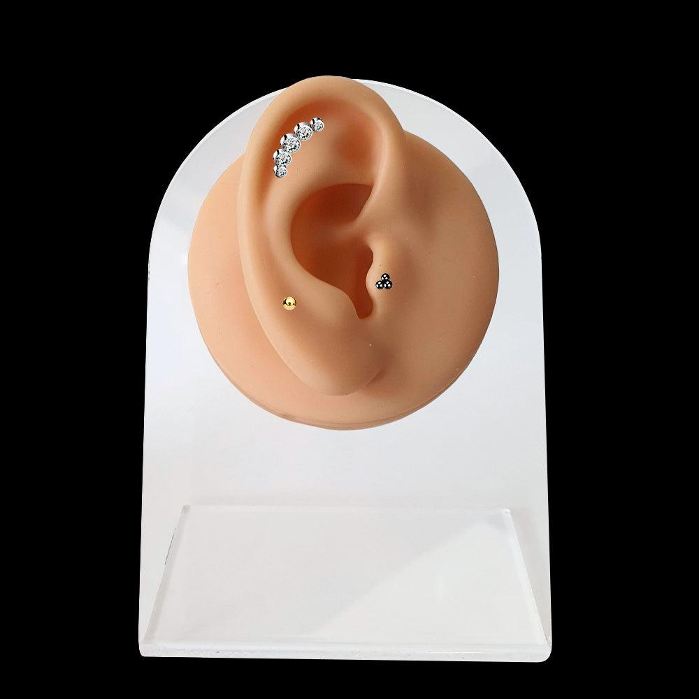 Oreja de silicona para piercings